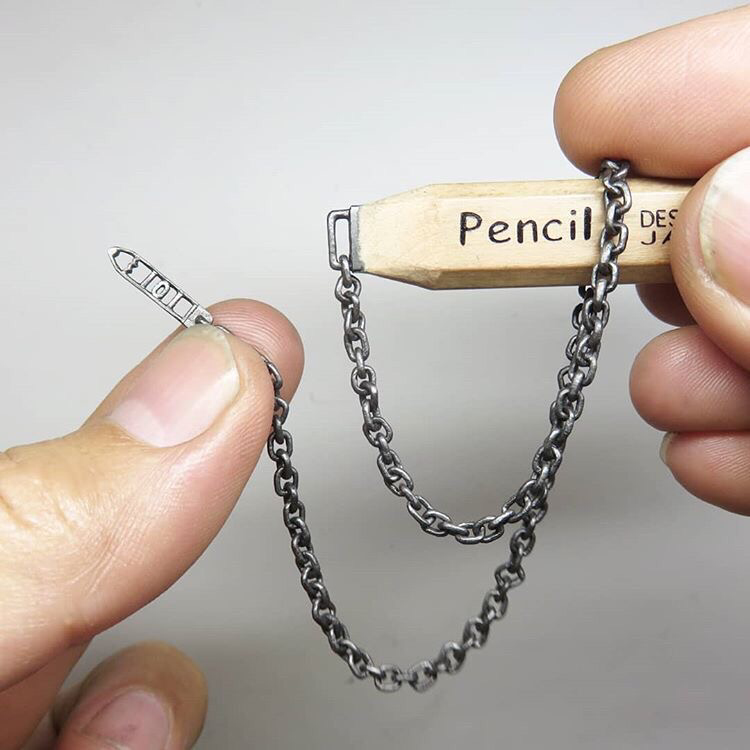 It's just chain link carved from pencil lead. NBD.