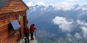 A mountain dwelling near a thousand foot cliff