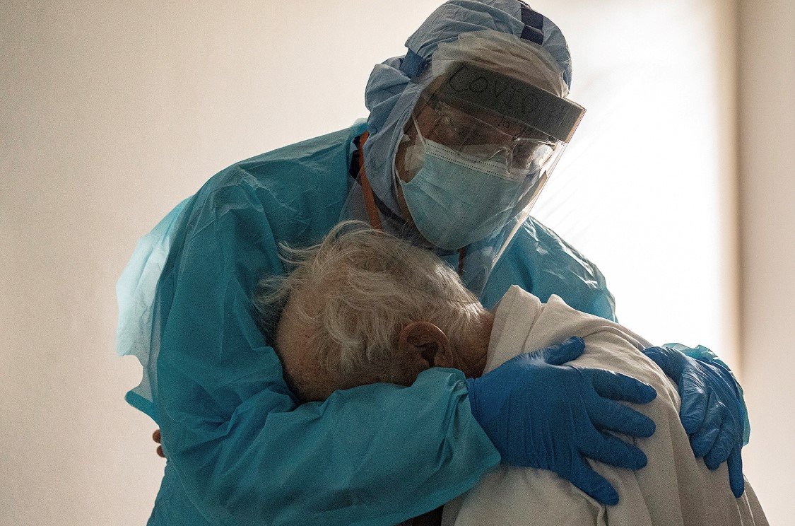 A Doctor comforting a Covid-19 Patient on Thanksgiving.