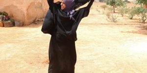Woman gets rid of her niqab after her village is liberated from ISIS