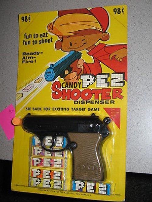 Pez made a dispenser where you had to put the gun in your mouth and pull the trigger.