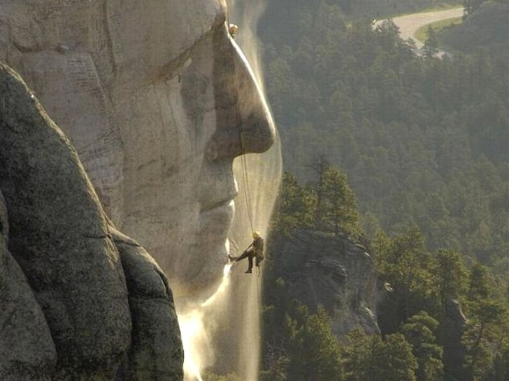 Pressure washing Mount Rushmore.