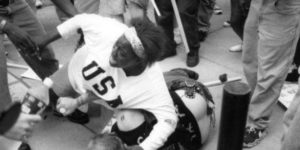 Then 18 year old Keshia Thomas throws herself on a KKK member to prevent his death from a mob of KKK protestors in Ann Arbor, Michigan.