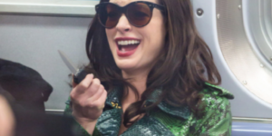 mood: anne hathaway holding a knife and laughing