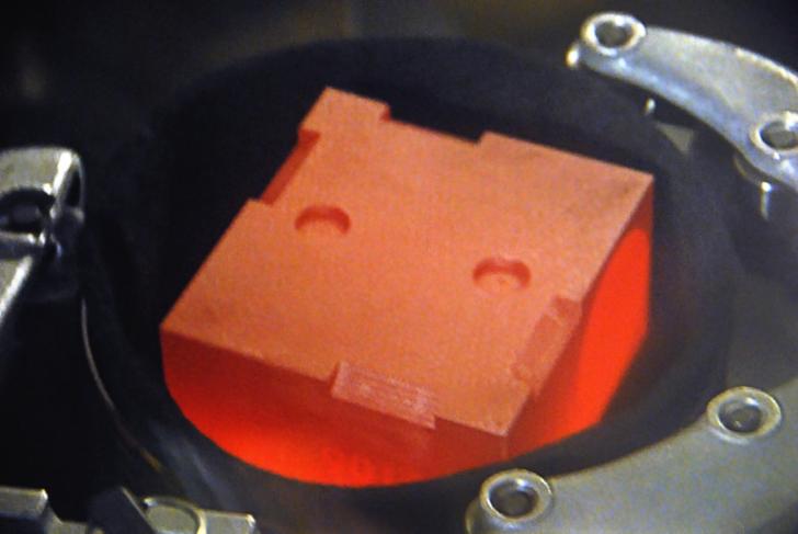 Curiosity's 4.8 kg of Plutonium-238 dioxide glowing its graphite container red hot. Heat given off by the decay of this isotope is converted into electric voltage by thermocouples, providing constant power during all seasons and through the