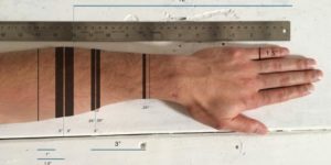A functional tattoo concept that turns arm into a ruler.