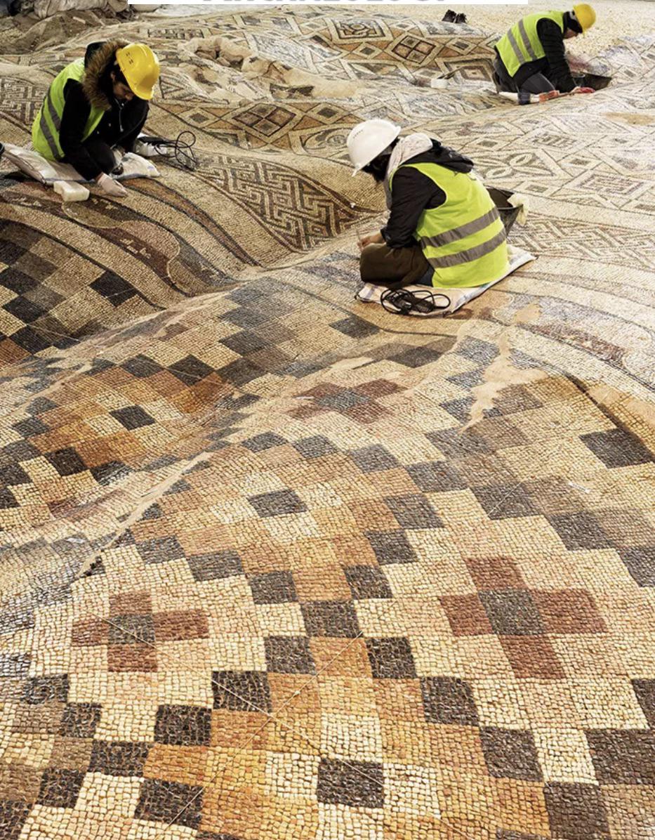 Restoring a mosaic rippled by earthquakes in Turkey. 