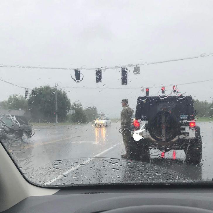 Soldier parked his jeep and stood at attention for a funeral procession passing by. Life deserves respect.