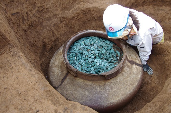 Ceramic Jar Containing Thousands of Bronze Coins Recently Unearthed at a 15th-Century Former Samurai's Residence