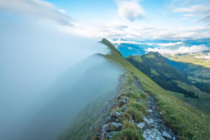 This ridge splitting the fog