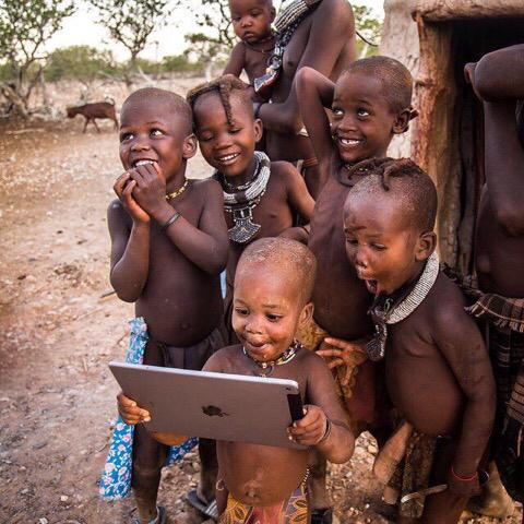 Tribal children see a iPad for the first time