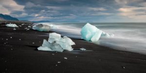 Black sands and blue ice by Richard Spurdens