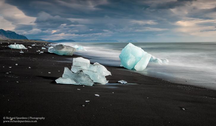 Black sands and blue ice by Richard Spurdens