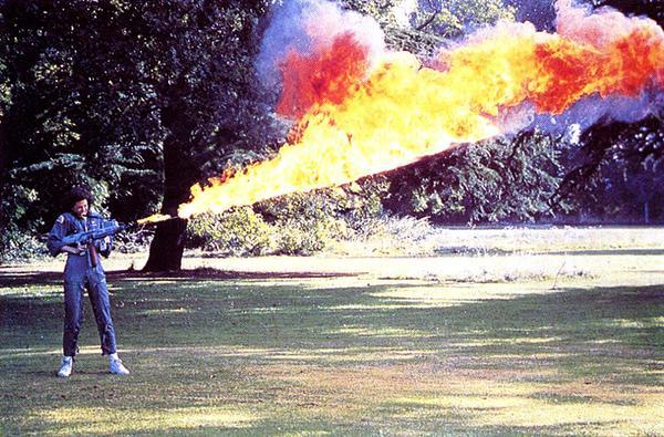 Sigorney Weaver testing the flamethrower for Alien on the lawn at Shepperton Studios