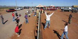 Americans and Mexicans playing volleyball over the US/Mexico border