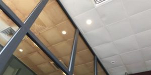 The ceiling tiles in the Da Nang airport smoking section vs. non-smoking section.