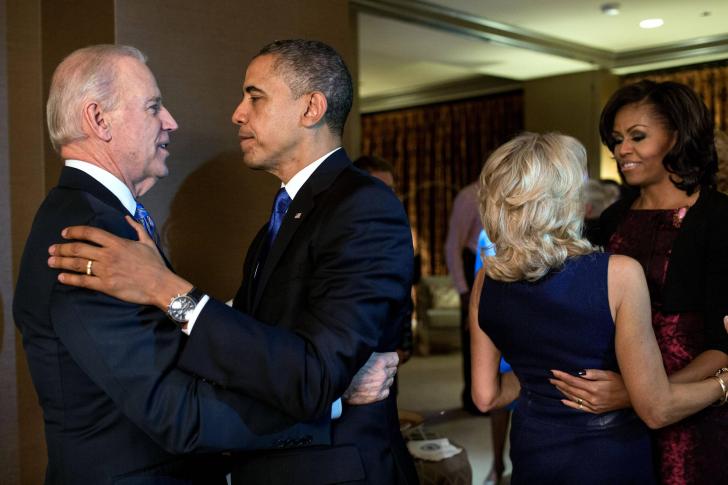 The Obamas and Bidens embracing