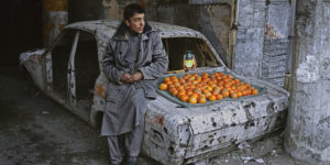 Boy selling oranges on the streets of Kabul, Afghanistan.