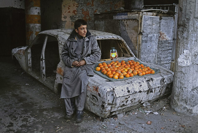Boy selling oranges on the streets of Kabul, Afghanistan.