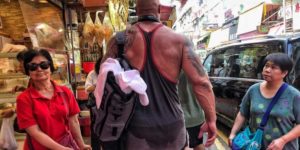 The Rock casually strolling through Hong Kong after leg day.