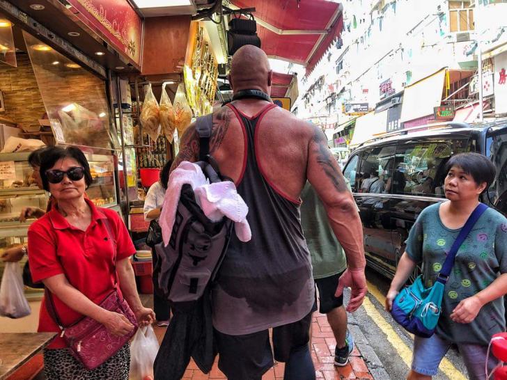 The Rock casually strolling through Hong Kong after leg day.