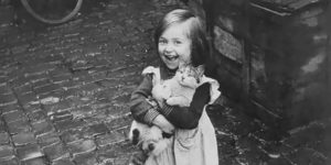 A girl and her cat, England, WWII., circish 1940