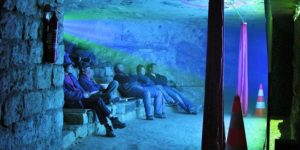 An illegal theatre deep in the catacombs of Paris.