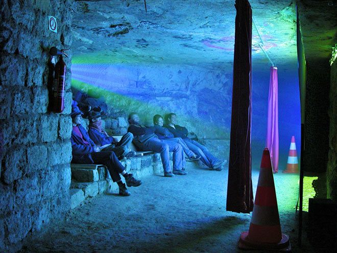 An illegal theatre deep in the catacombs of Paris. 