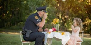 2 year old throws tea party for police officer who saved her life