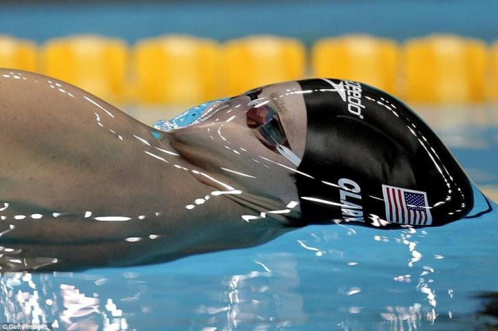 Fantastic shot of Olympic swimmer before breaking the surface tension of water