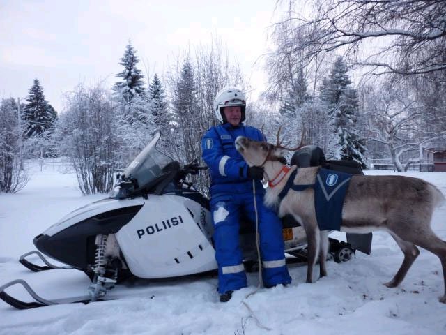 This is a Finnish police with his police reindeer.