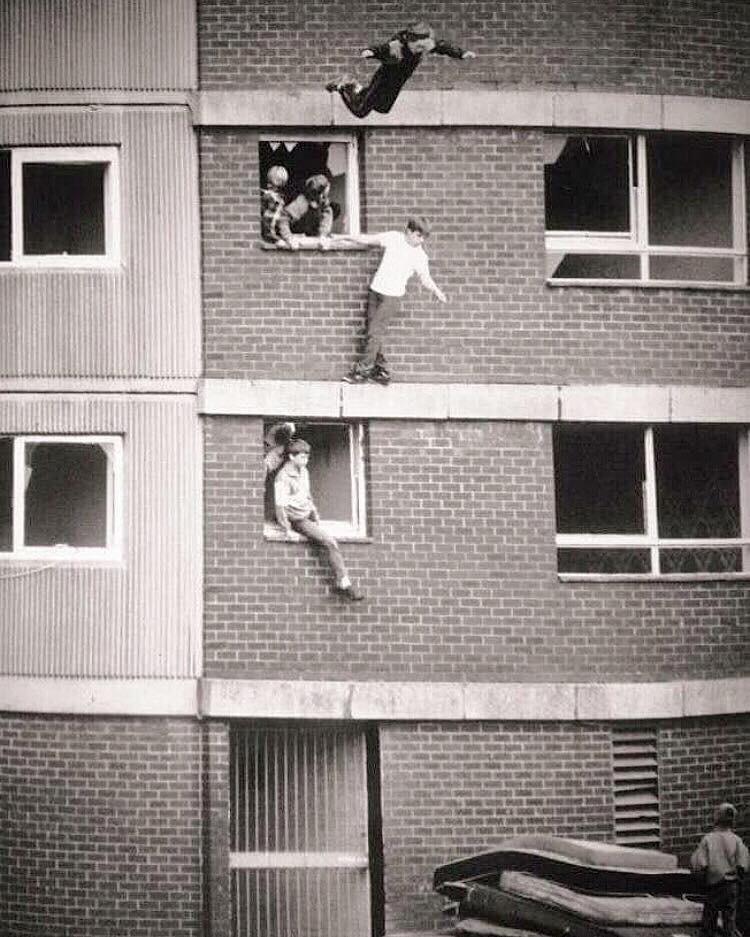 Kids jumping at a pile of mattresses, circa 1977.