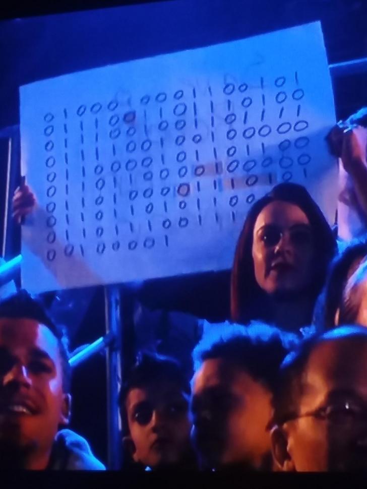 "Destroy All Humans" written in Binary on a sign at BattleBots.