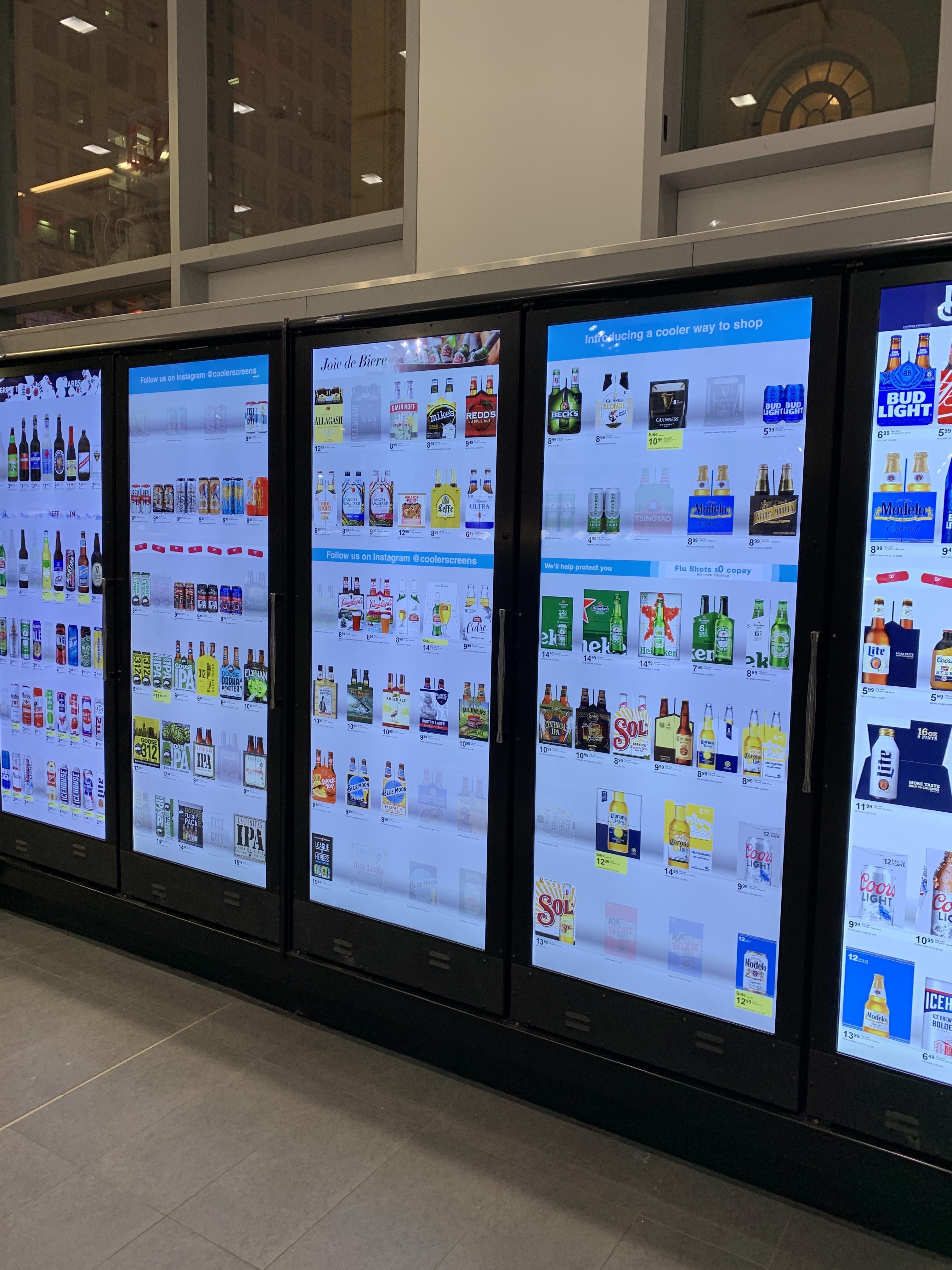 This Walgreens refridgerated section has screens that show what's inside instead of glass doors to conserve energy.