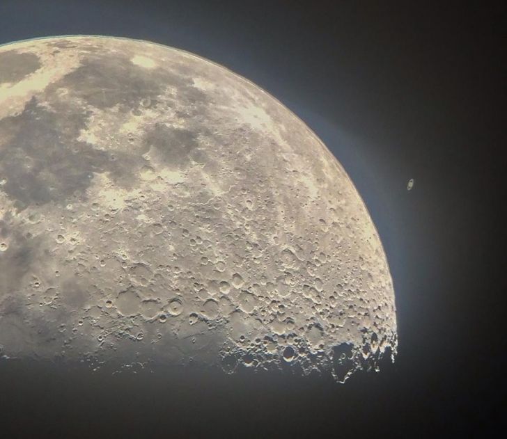 Saturn appearing from behind the Moon