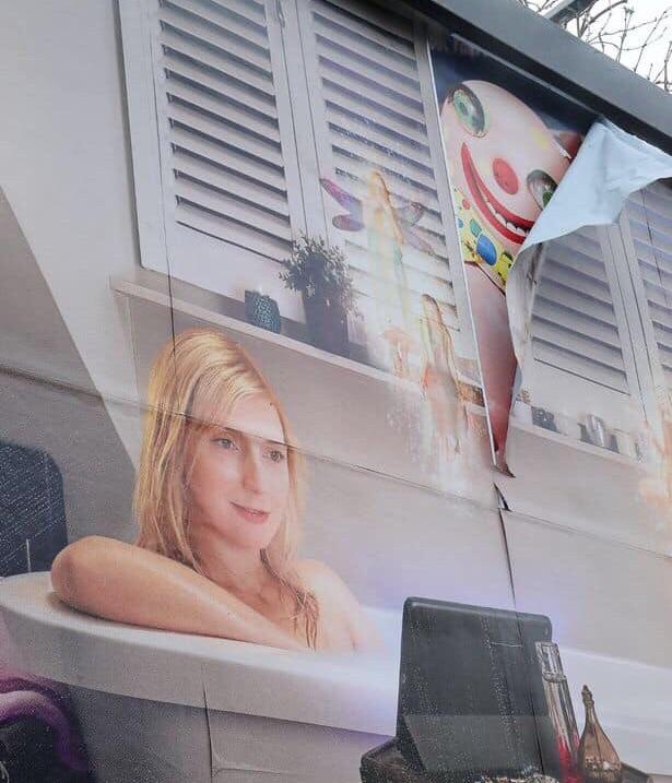 This billboard ad peeling off is v creepy