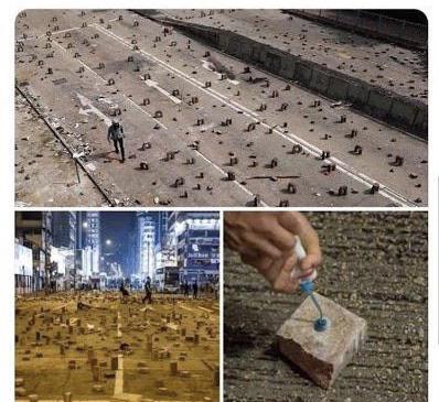 HK protesters are gluing bricks to the road to disrupt traffic flows.