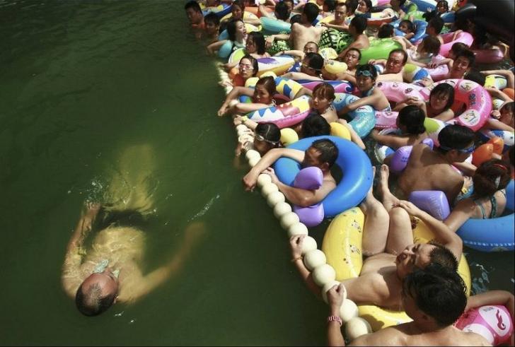 In China, You Can Pay Extra To Get in the uncrowded section of the swimming area. This is the result.
