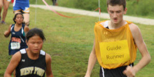 Blind cross country runner with guide