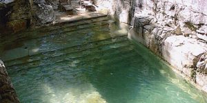 Pool built into limestone.