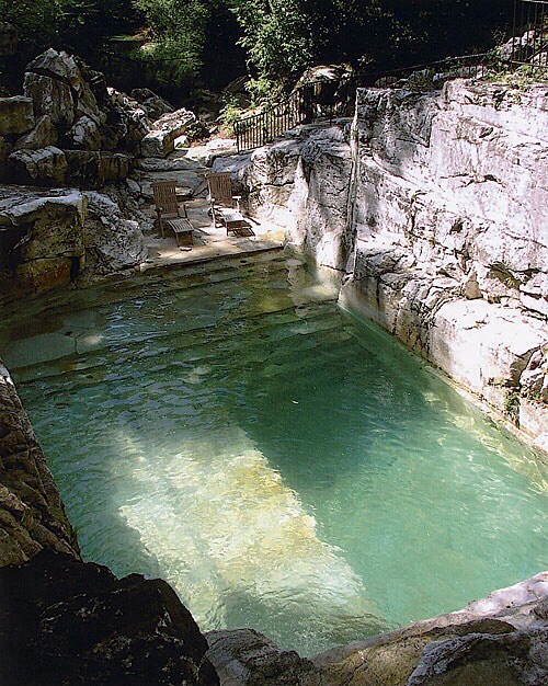 Pool built into limestone.