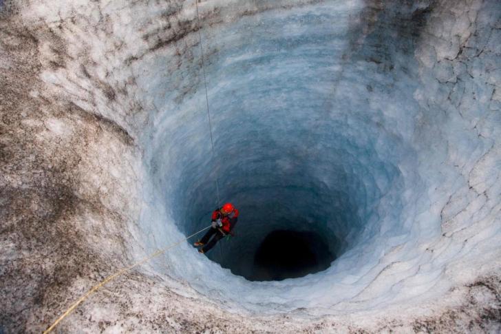 Check out that man in a gigantic icehole.