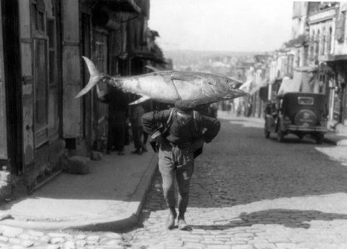 A Turkish fisherman returns with his booty, circish 1925.