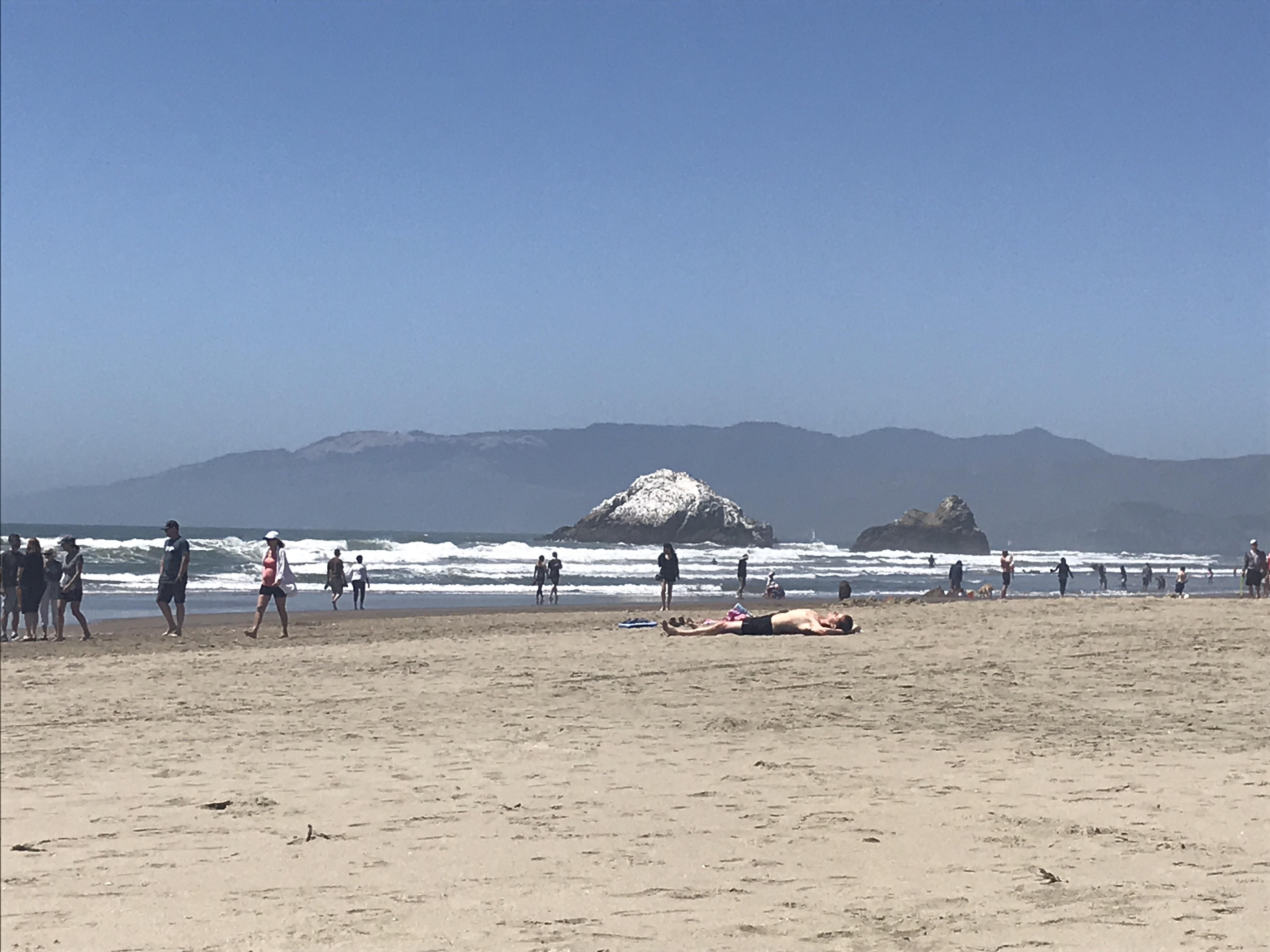 The rock at Ocean Beach, SF looks like it has snow on it; It's bird excrement.