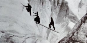 Late Victorian mountaineers cross a crev[ass]e in the Alps, circa 1900.