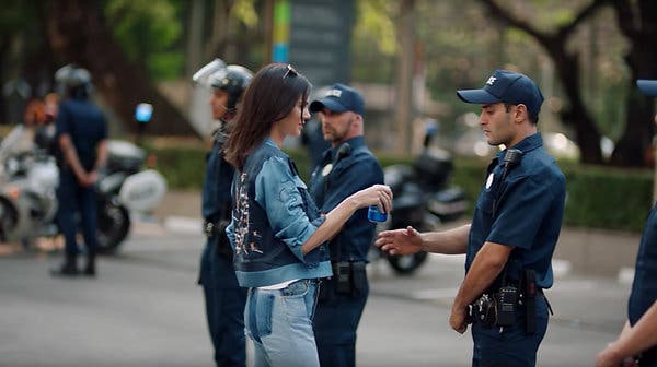 Kylie Jenner ends the Hong Kong protests using a can of Pepsi, circa 2020