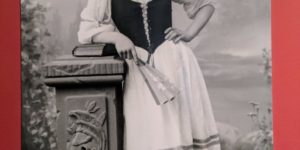 A very bored looking Andy Samberg hanging out as a woman in the 1800’s.