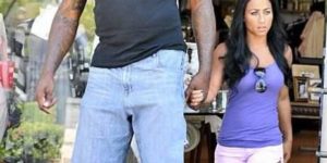 Shaq and his human sized girlfriend.