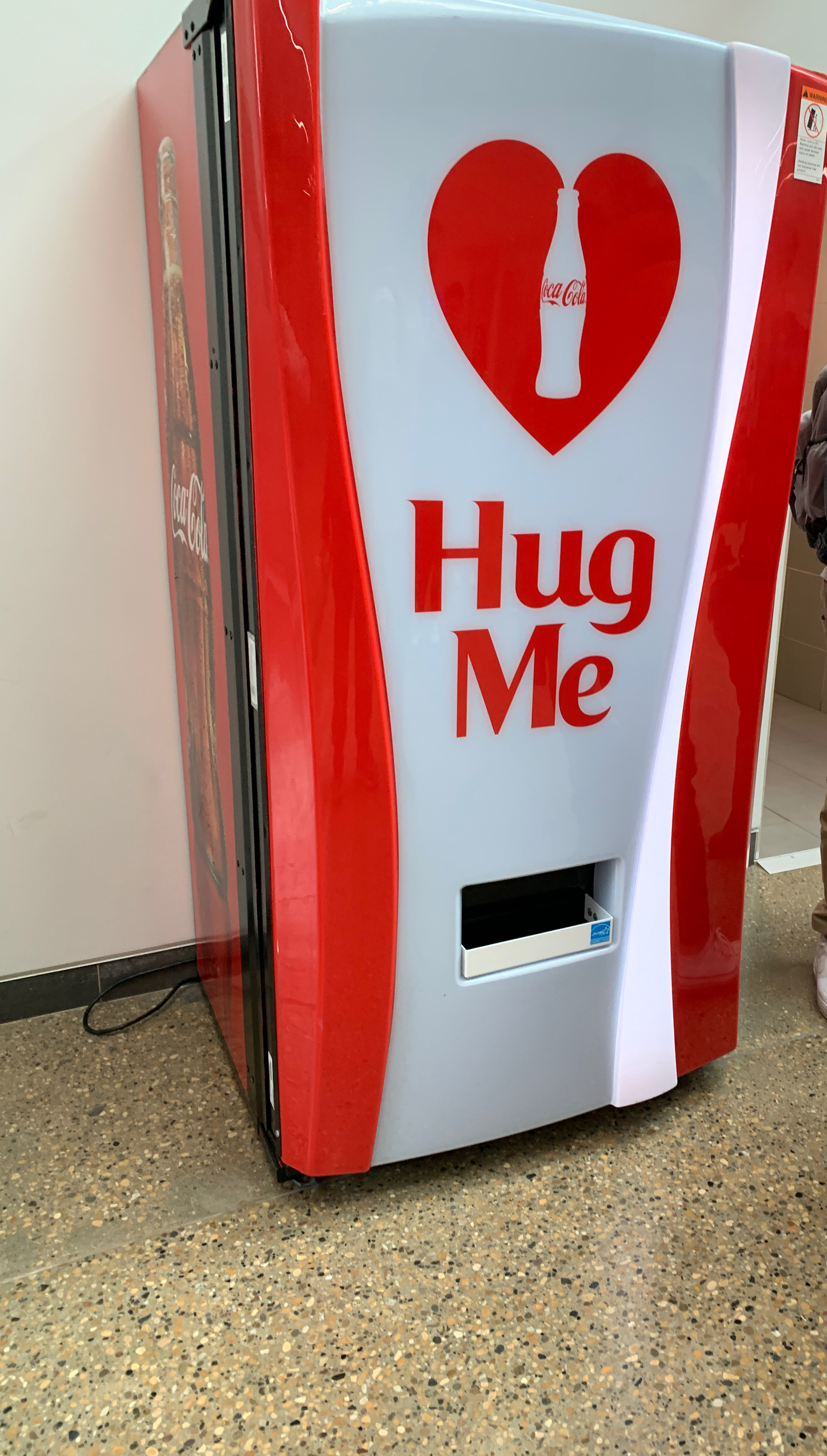 A vending machine that gives you a free coke in exchange for a hug.