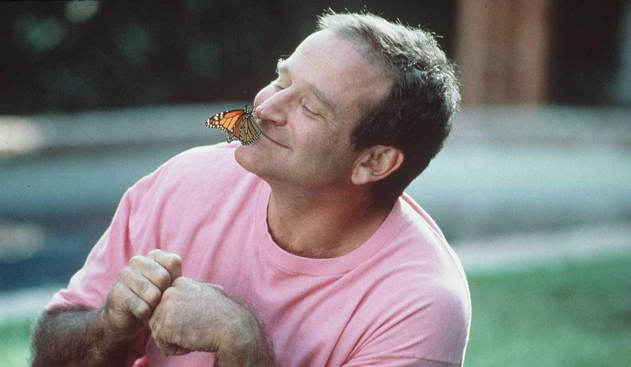 Robin Williams having a moment with a monarch.